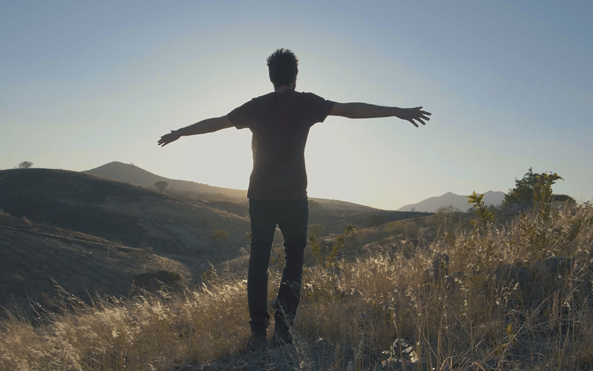 man enjoying the wind